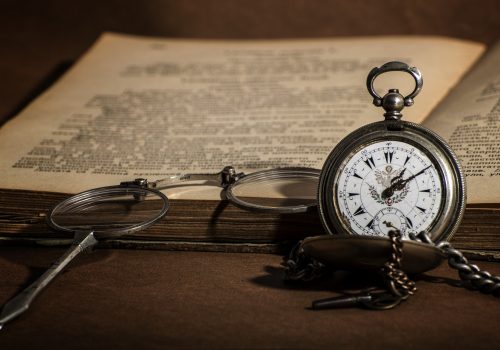 glasses, stopwatch, and open book stock photo