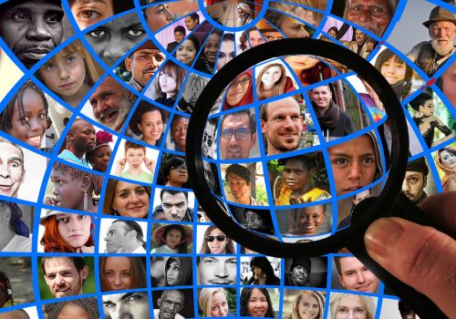 photos of people under a magnifying glass graphic